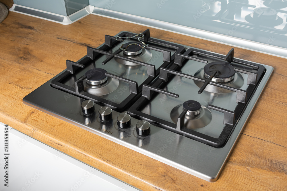 Modern gas stove with stainless steel and pan Modern gas stove with stainless steel and pan