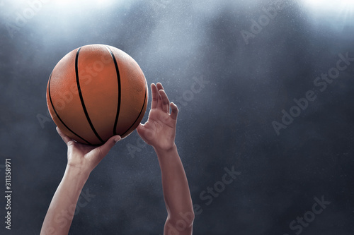 Basketball player throwing a ball © fotokitas