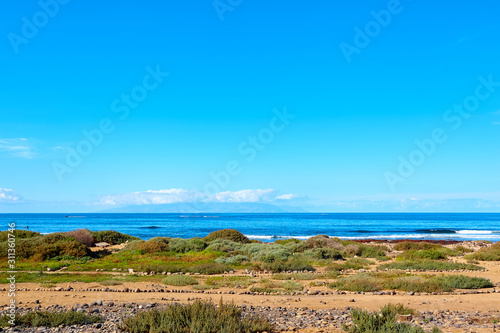 Amazing view of the ocean and beach on a sunny summer day. Canary islands landscape. Tourism.
