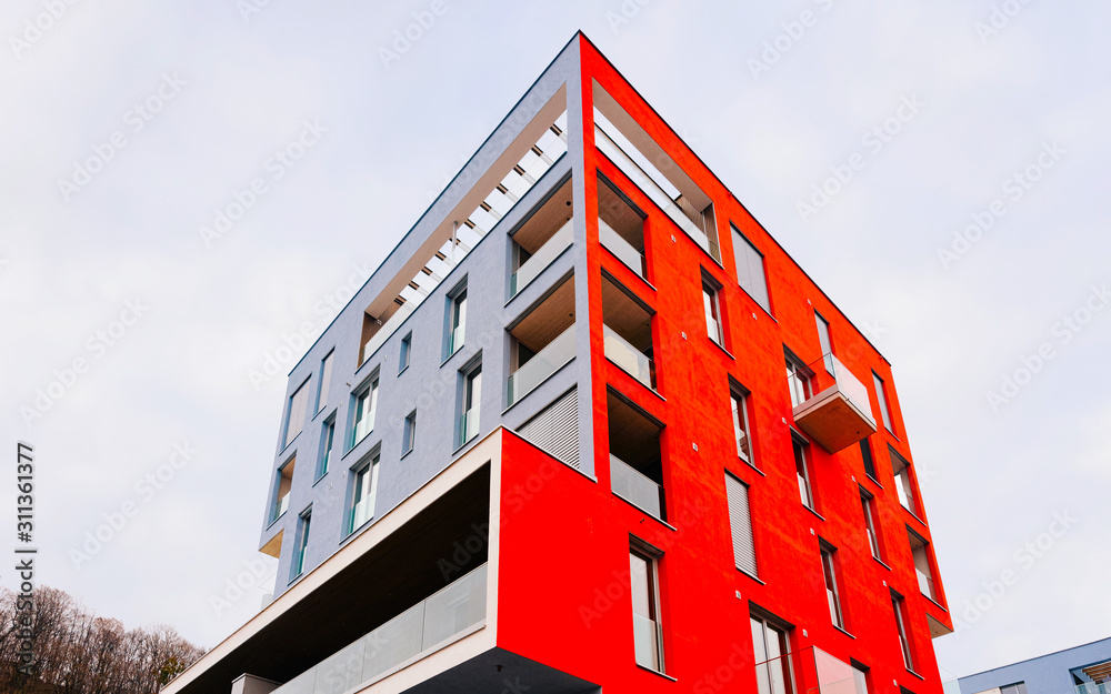Red Modern residential apartment and flat building exterior of Salzburg reflex