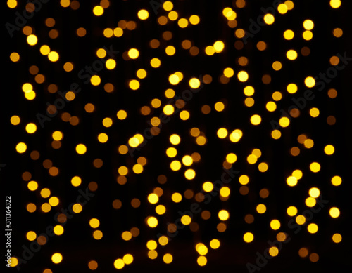 abstract background - photo of yellow bokeh on a black