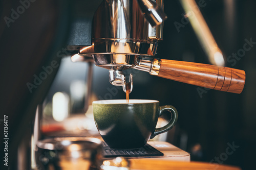 Close-up of espresso pourin...