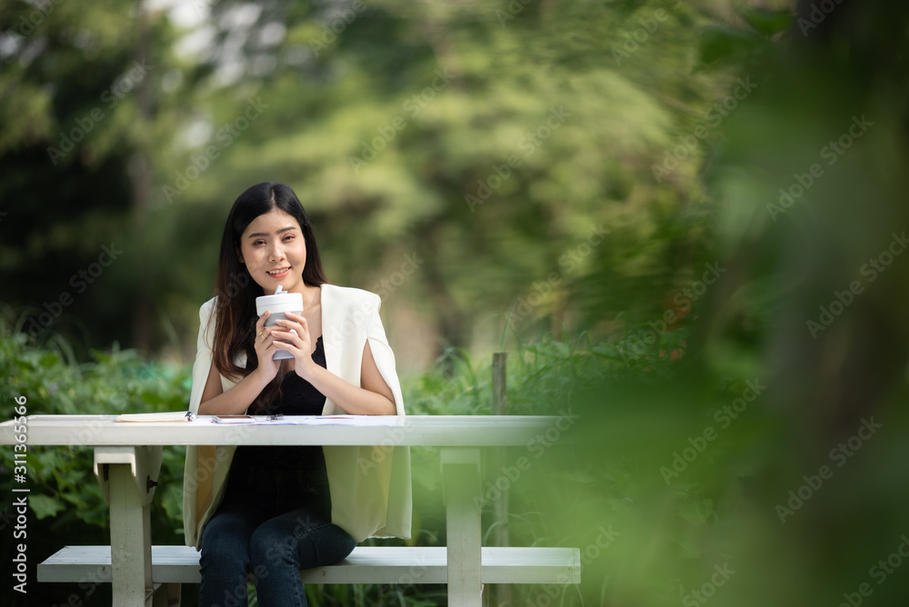 business women with morning coffee, working in garden business women with morning coffee, working in garden
