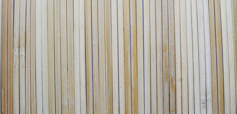 Rural background from light wooden planks in vertical parallel pattern. Wood wall facade fragment texture. Rural background from light wooden planks in vertical parallel pattern. Wood wall facade fragment texture.