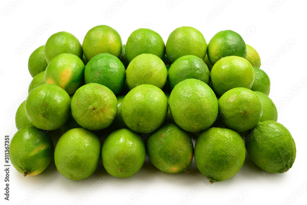 Many fresh limes on white background. Many fresh limes on white background.