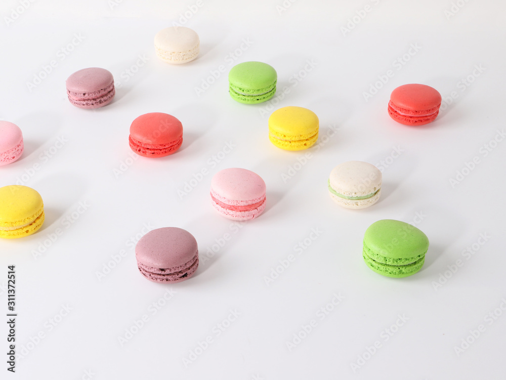 Fototapeta premium Colored macarons on white background