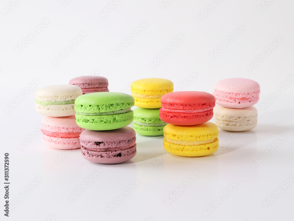 Fototapeta premium Colored macarons on white background