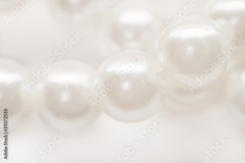 Macro white pearl beads string isolated background