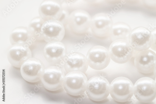 White pearl necklace little beads isolated background