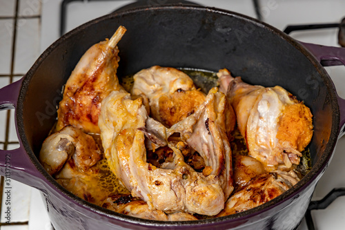 Sliced ​​rabbit stew in a brazier.