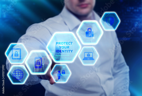 Cyber Security Data Protection Business Technology Privacy concept. Young businessman select the icon Protect your identity on the virtual display.