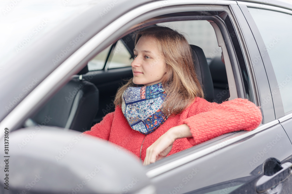 woman sitting for steering wheel in car woman sitting for steering wheel in car
