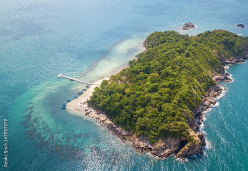 Aerial view of beautiful tropical island with white sand beach and blue cloud sky at Koh Tha Lu