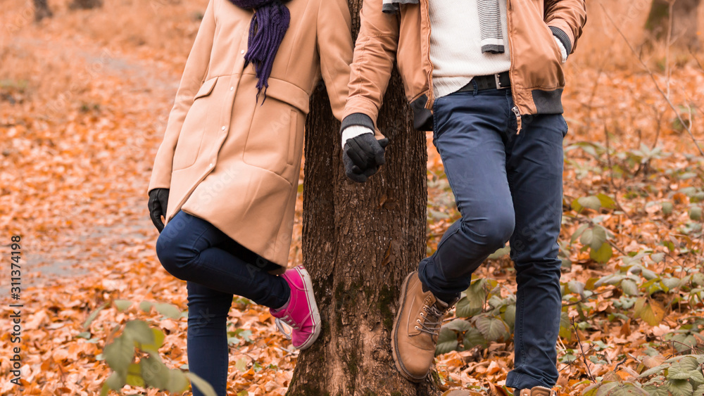 Couple in the park enjoying nice autumn / winter time. Couple in the park enjoying nice autumn / winter time.