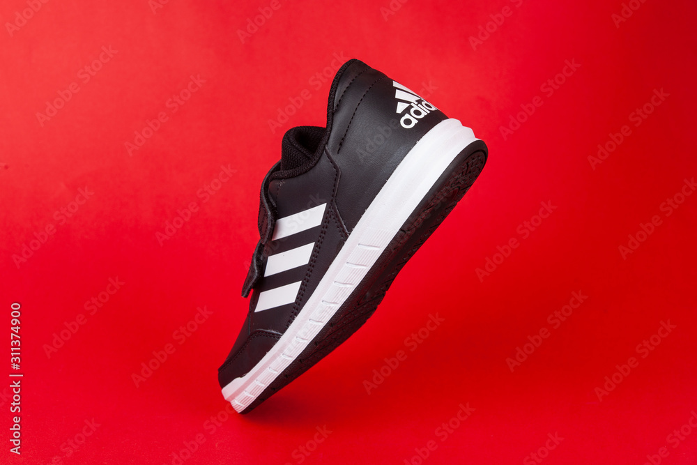 Varna , Bulgaria - AUGUST 13, 2019 : ADIDAS ALTA SPORT shoe, on red  background. Product shot. Adidas is a German corporation that designs and  manufactures sports shoes, clothing and accessories Stock Photo | Adobe  Stock