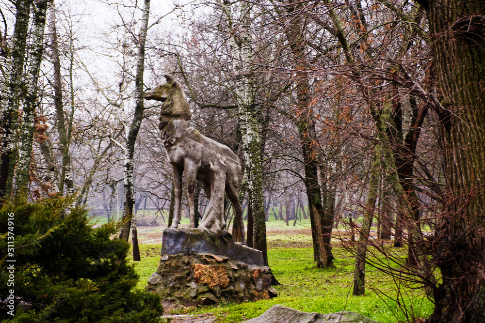 Old abandoned monument in an empty autumn park