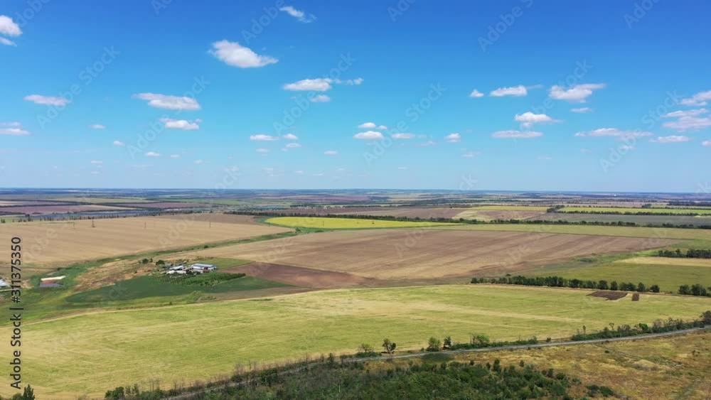 Aerial view of agricultural fields. You can see the sunflower field, the plowed field, the pond Aerial view of agricultural fields. You can see the sunflower field, the plowed field, the pond