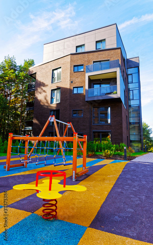 Children playing ground at Modern complex of apartment residential buildings reflex