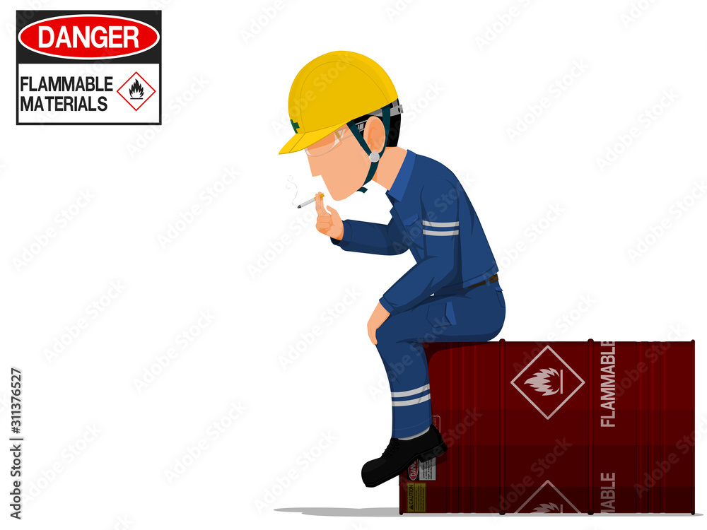 A worker is smoking on the flammable barrel A worker is smoking on the flammable barrel