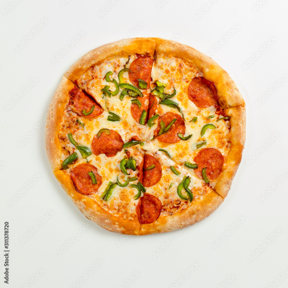 Sliced delicious fresh pizza with pepperoni and cheese on a white plate. Top view with copy space for text. Flat lay Sliced delicious fresh pizza with pepperoni and cheese on a white plate. Top view with copy space for text. Flat lay