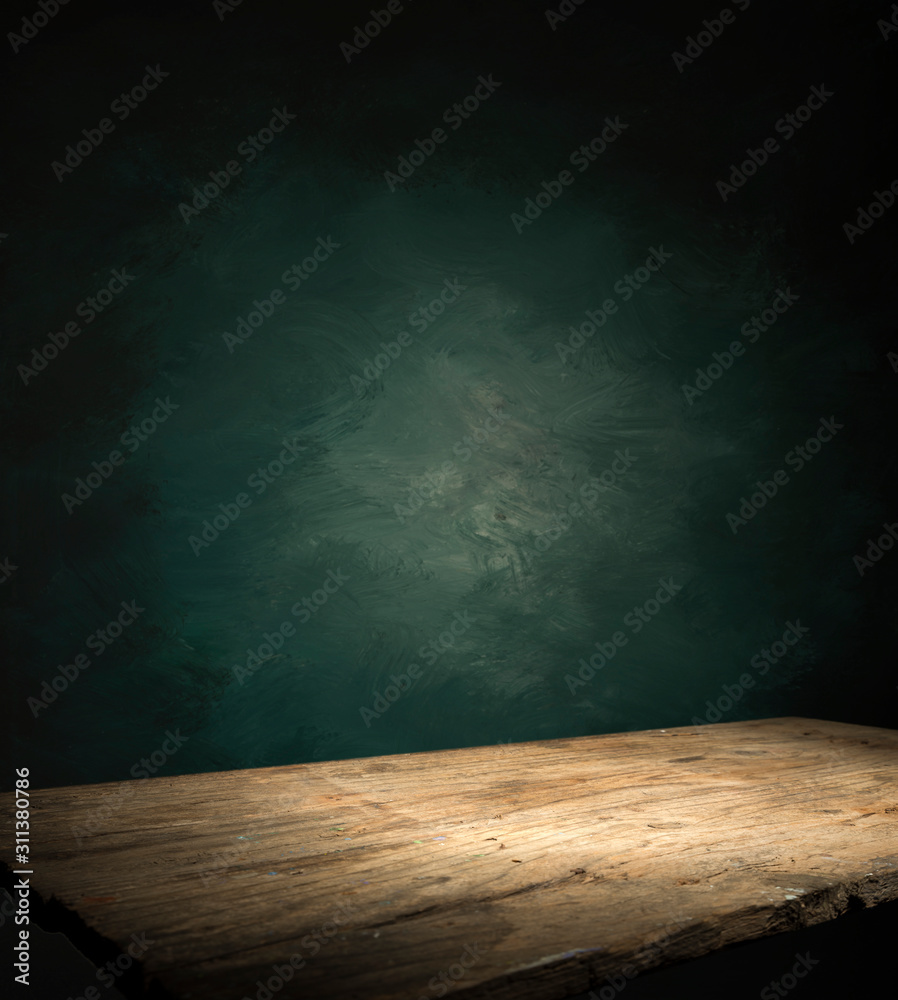 Fototapeta Wood table in front of rustic brick wall blur background with empty copy space on the table for product display mockup. Retro design montage presentation.