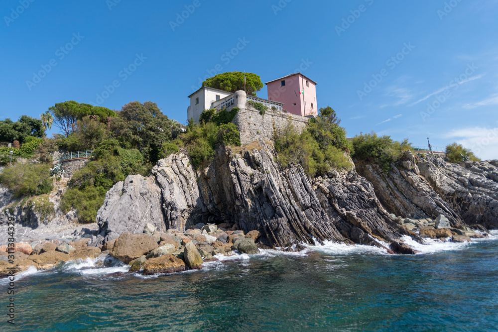 Rocky coastline on sunny day near Genoa Nervi, Italian Riviera