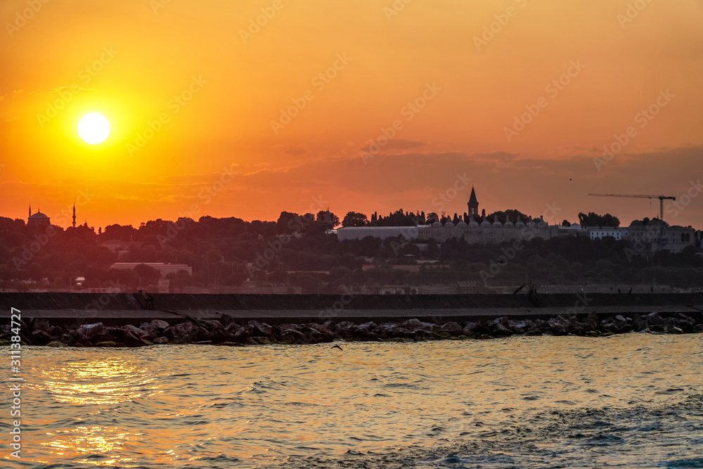 Sunset in istanbul, silhouette of the historical peninsula. Sunset over Topkapı Palace and Historical Peninsula