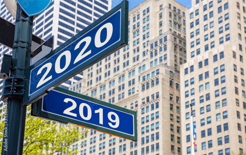 Wallpaper Mural 2020 new year and year 2019 Streets signs. Highrise buildings  background Torontodigital.ca