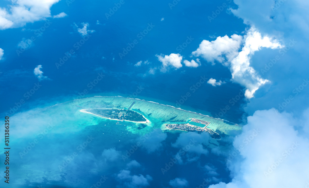 Fototapeta premium maldives, maldive, aerial view, landscape, drone photography, blue sky, bird eye view, beach, drone, aerial, background, travel, atolls, turquoise, beautiful, blue, above, blue sea, nature, famous isl