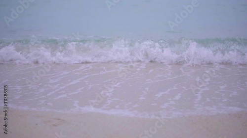 Sea waves crashing on the beach.