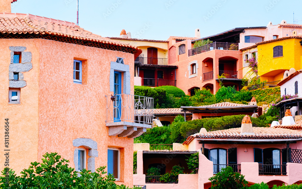 Windows and balconies of residential house complex of Porto Cervo reflex