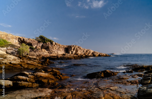 Afternoon sea view, rocks, boat in the island 