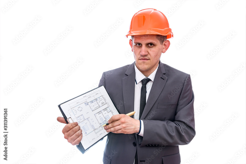 Man in helmet pointing with pen at clipboard Man in helmet pointing with pen at clipboard
