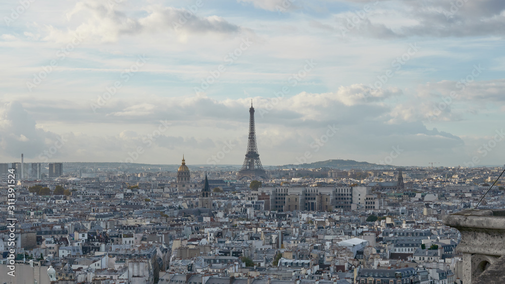 Panoramic view to the Paris and river Seine from the roof of Notre Dame cathedral, France. Cloudy weather. Autumn.      