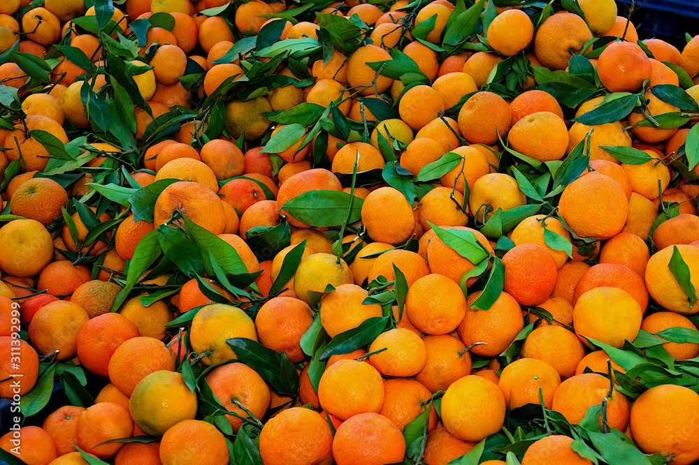Fresh organic tangerines lying on the counter of the greengrocer in the eastern market