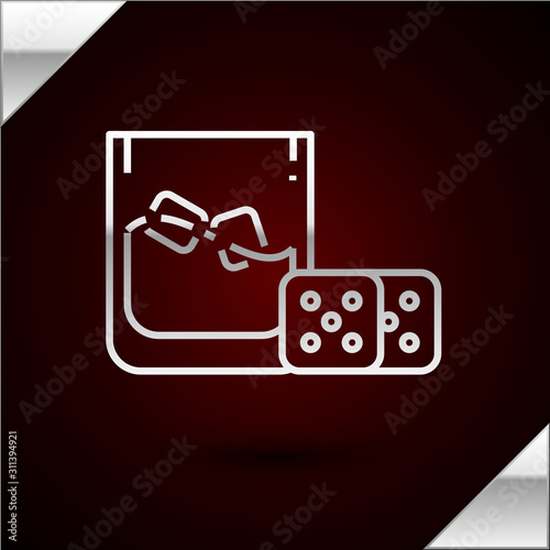 Silver line Game dice and glass of whiskey with ice cubes icon isolated on dark red background. Casino gambling. Vector Illustration