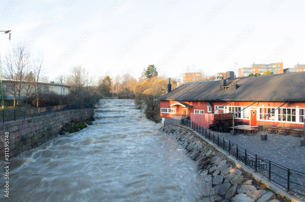 Fototapeta premium house on the waterfall on river