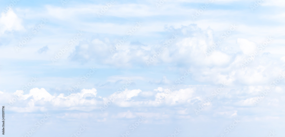 Naklejka premium Pastel soft banner with summer blue sky and white clouds. Natural background. Heaven, paradise and hope metaphor.