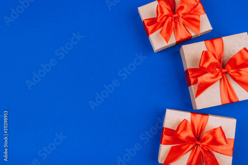 Frame of cardboard gift boxes with bows. © Anna