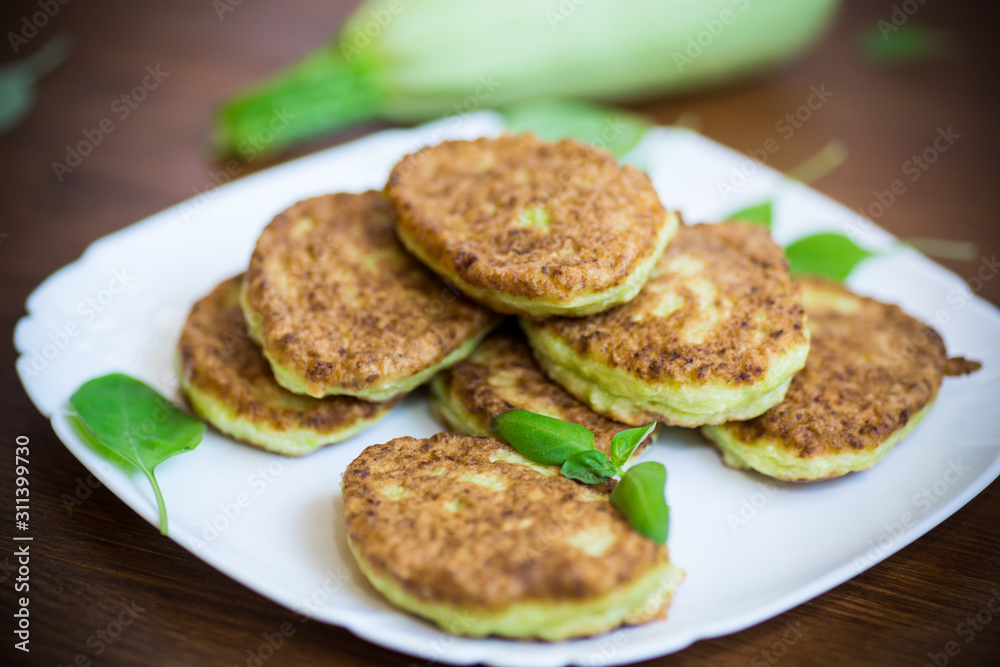 vegetable fritters made from green zucchini in a plate vegetable fritters made from green zucchini in a plate