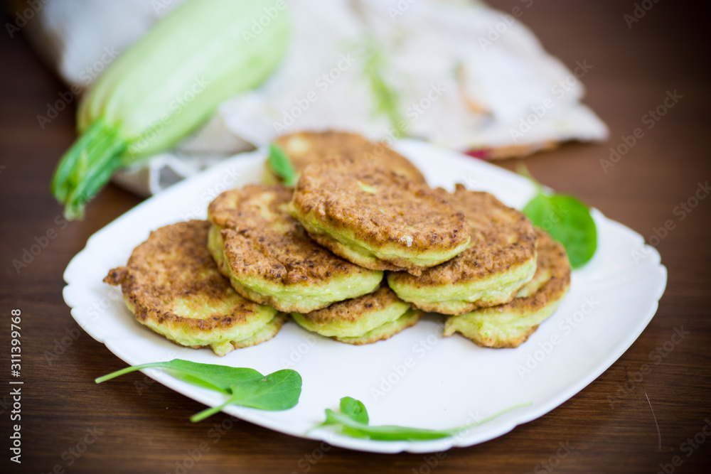 vegetable fritters made from green zucchini in a plate vegetable fritters made from green zucchini in a plate