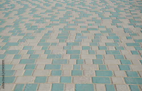 Texture of white and green paving slabs