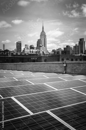 Solar Panels on a roof in Manhattan with the Empire State Building in the Background