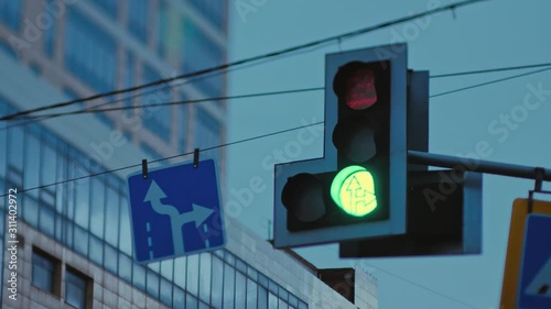 Traffic light on the background industrial building