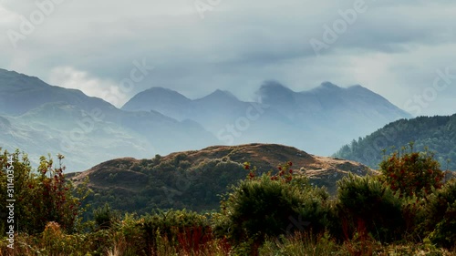 Sun Beams over Scenic Highlands in Scotland photo