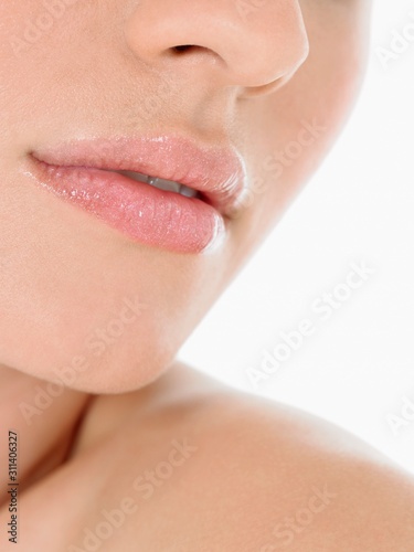 Closeup Of Young Woman Wearing Pink Lipstick