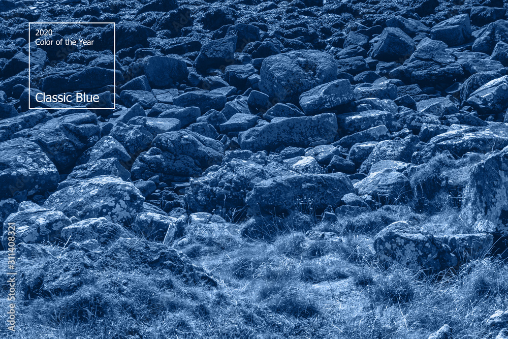 Naklejka premium Color of the year 2020 concept, classic blue colored trend for your design. Copy space. COY2020. Ancient mountain rock landscape in Scotland. Beautiful scottish backdrop