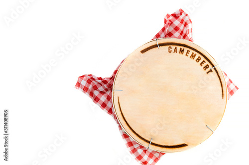 Wooden box with camembert cheese on white background - top view