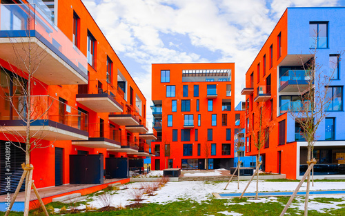 Red Modern residential apartment and flat building exterior at Salzburg reflex