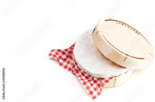 Camembert cheese in wooden box on white background